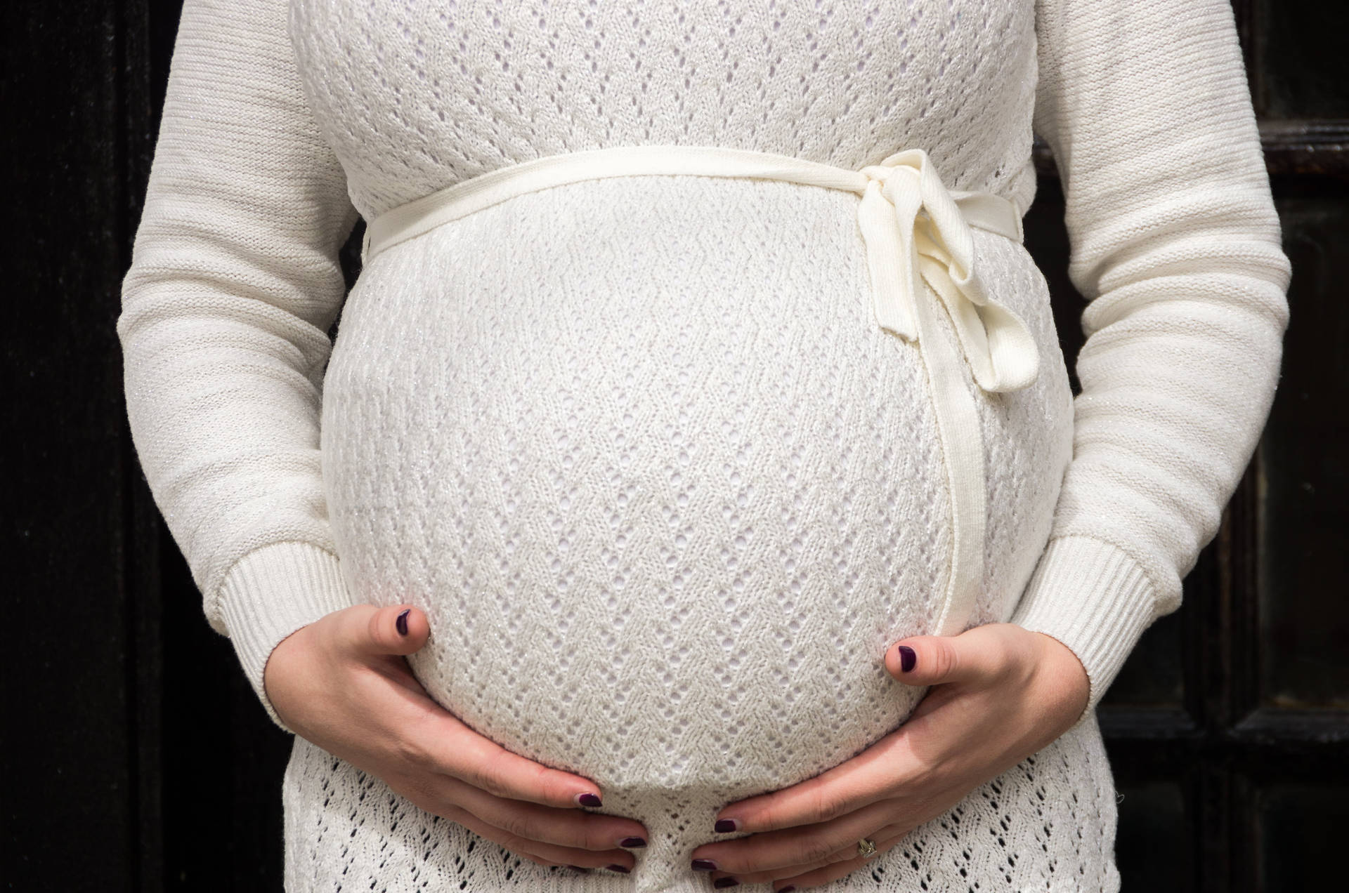 Pregnant In Knitted Dress Background