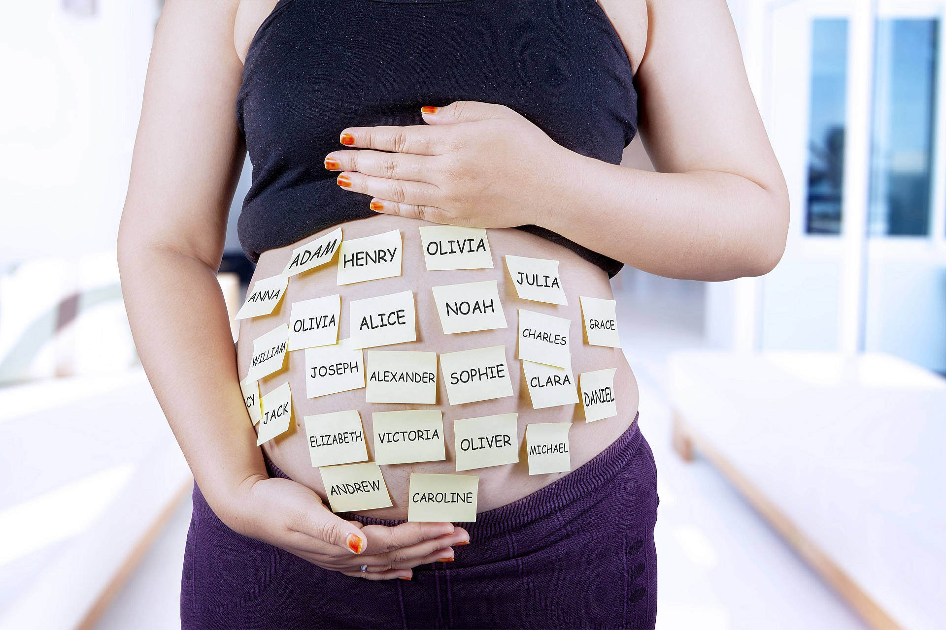 Pregnant Tummy With Baby Names Background