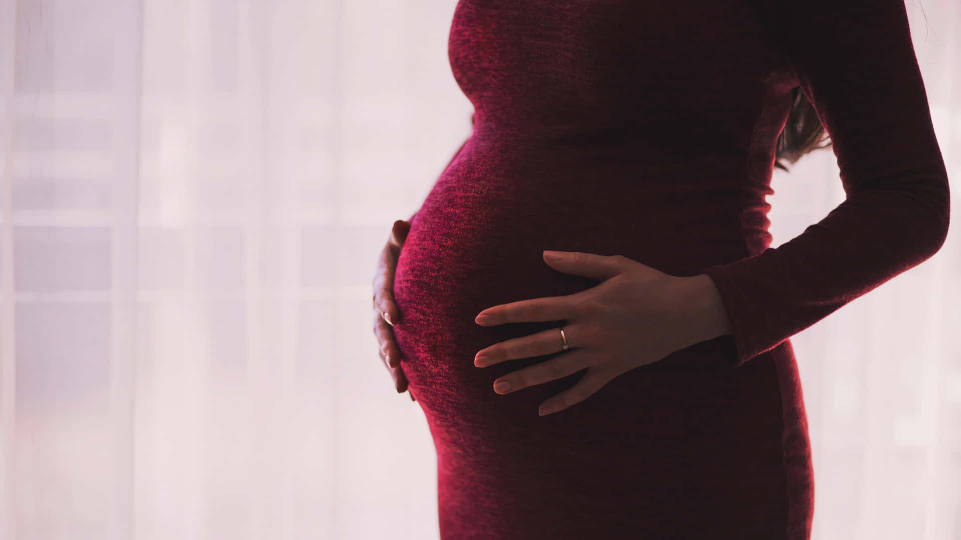 Pregnant Woman Holding Her Belly