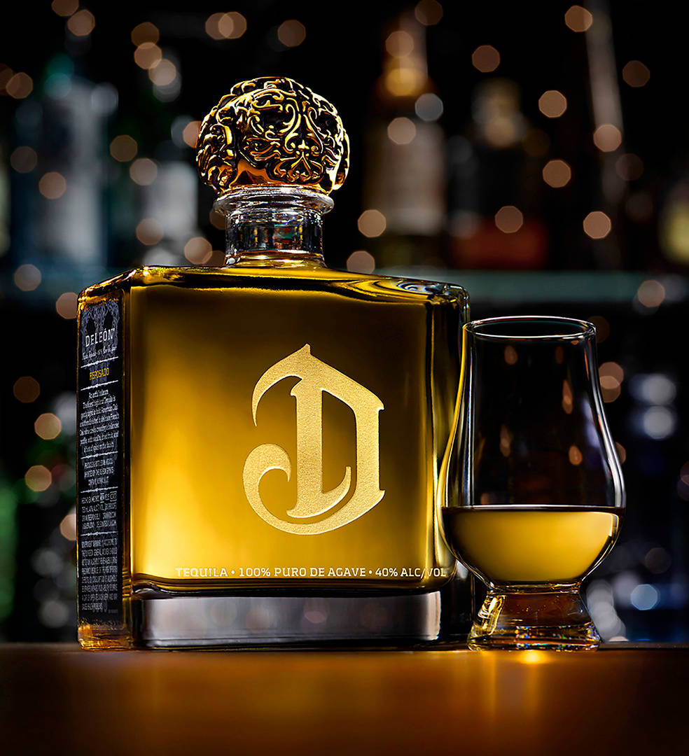 Premium Deleon Gold Tequila - A Toast To The High Life Background