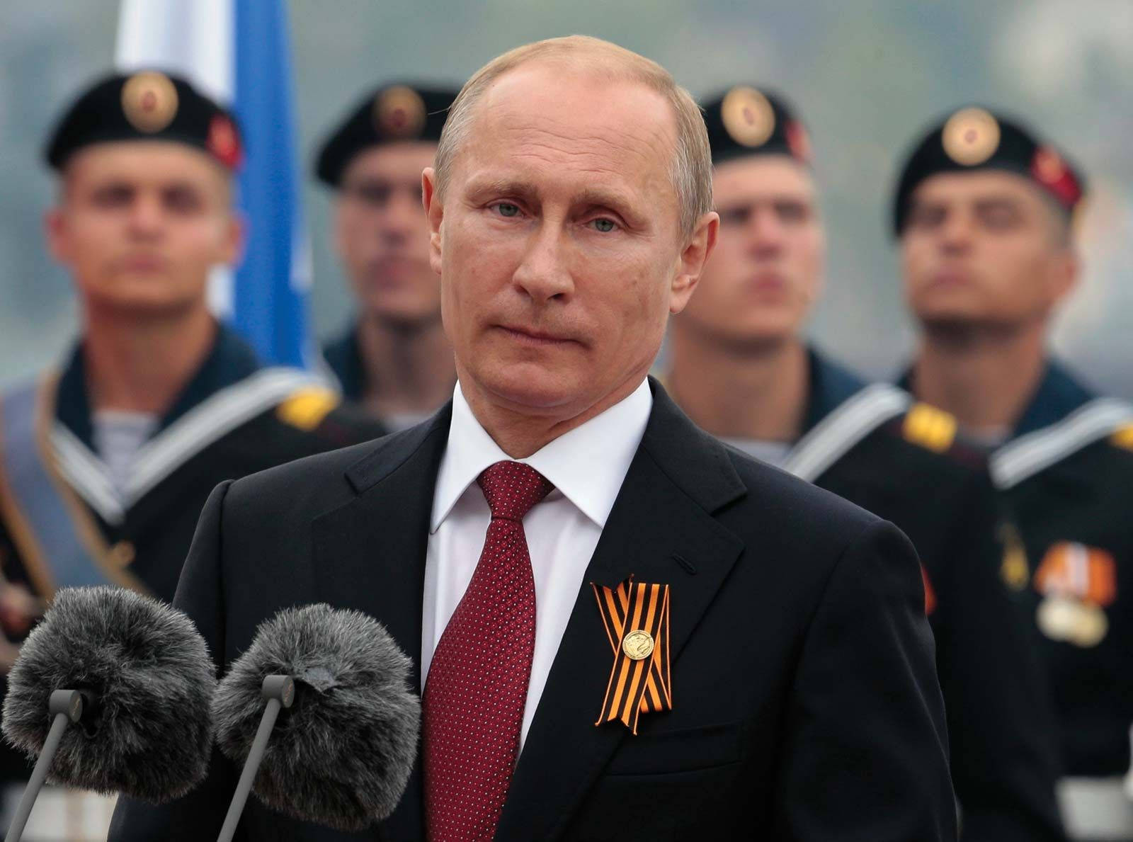 President Vladimir Putin Engaged In A Serious Gaze With The Camera. Background