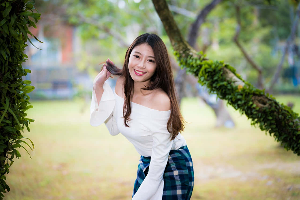 Pretty Asian In Park Background