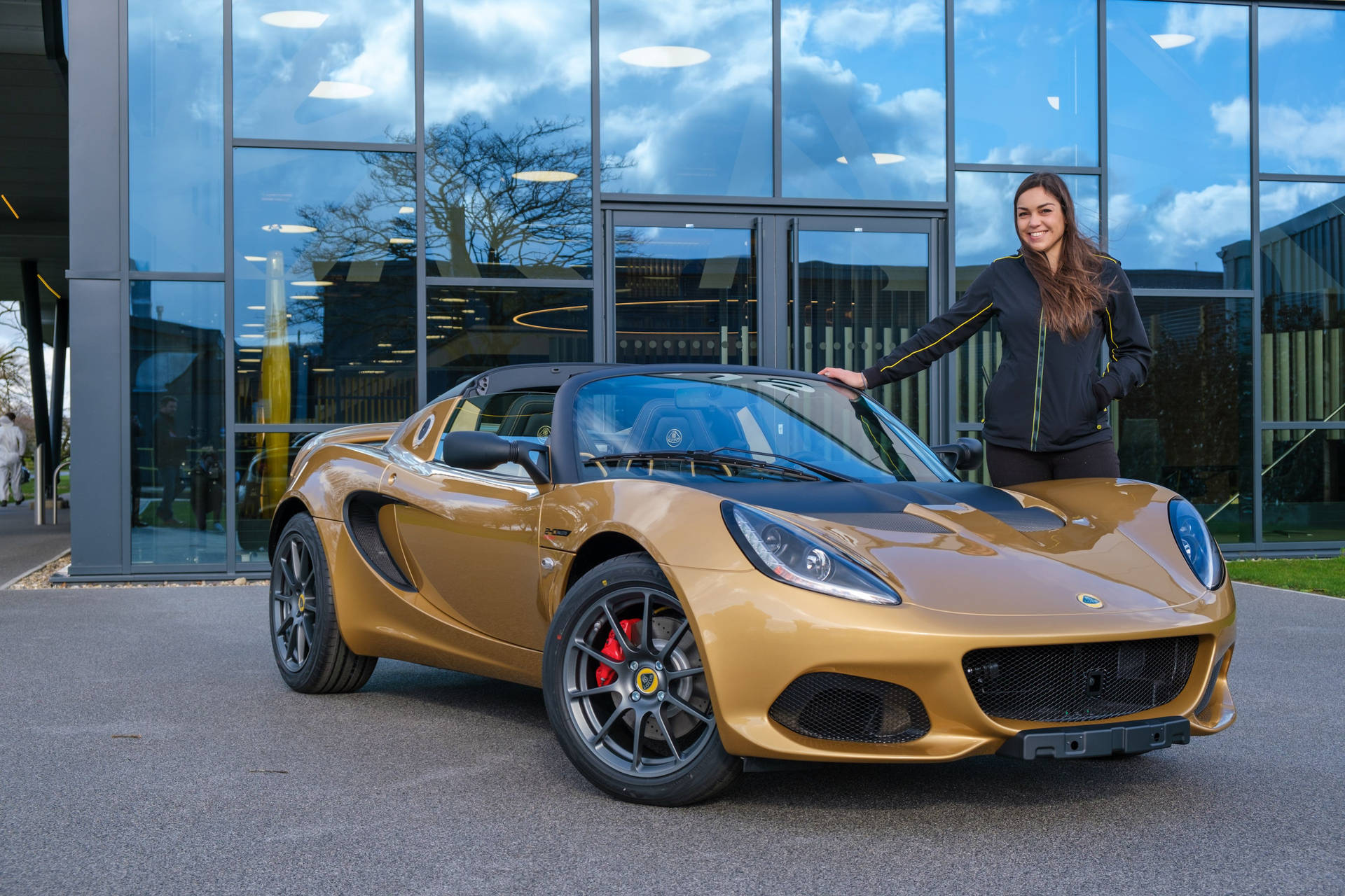 Pretty Lady With A Golden Lotus Car Background