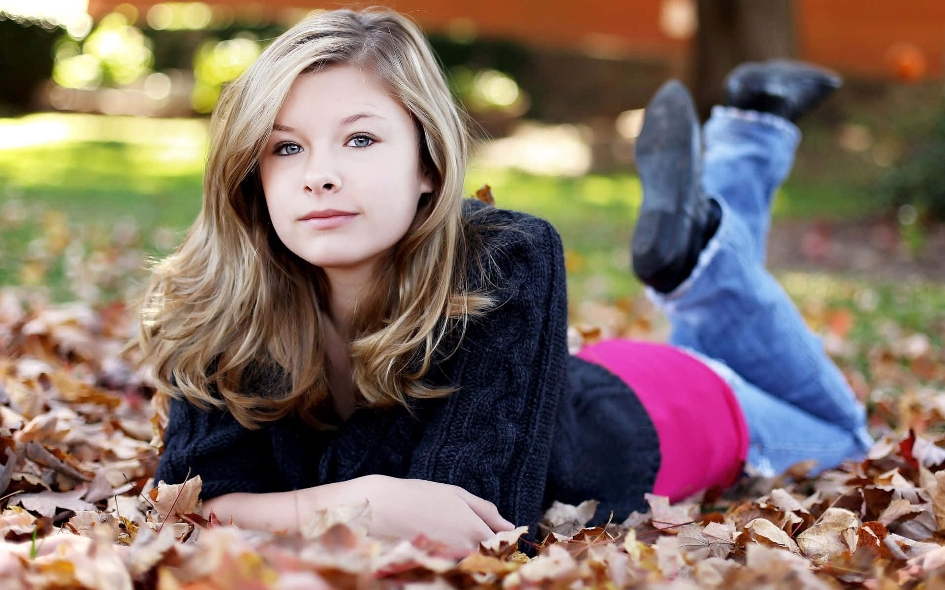 Pretty Teen Girl On Grass Background