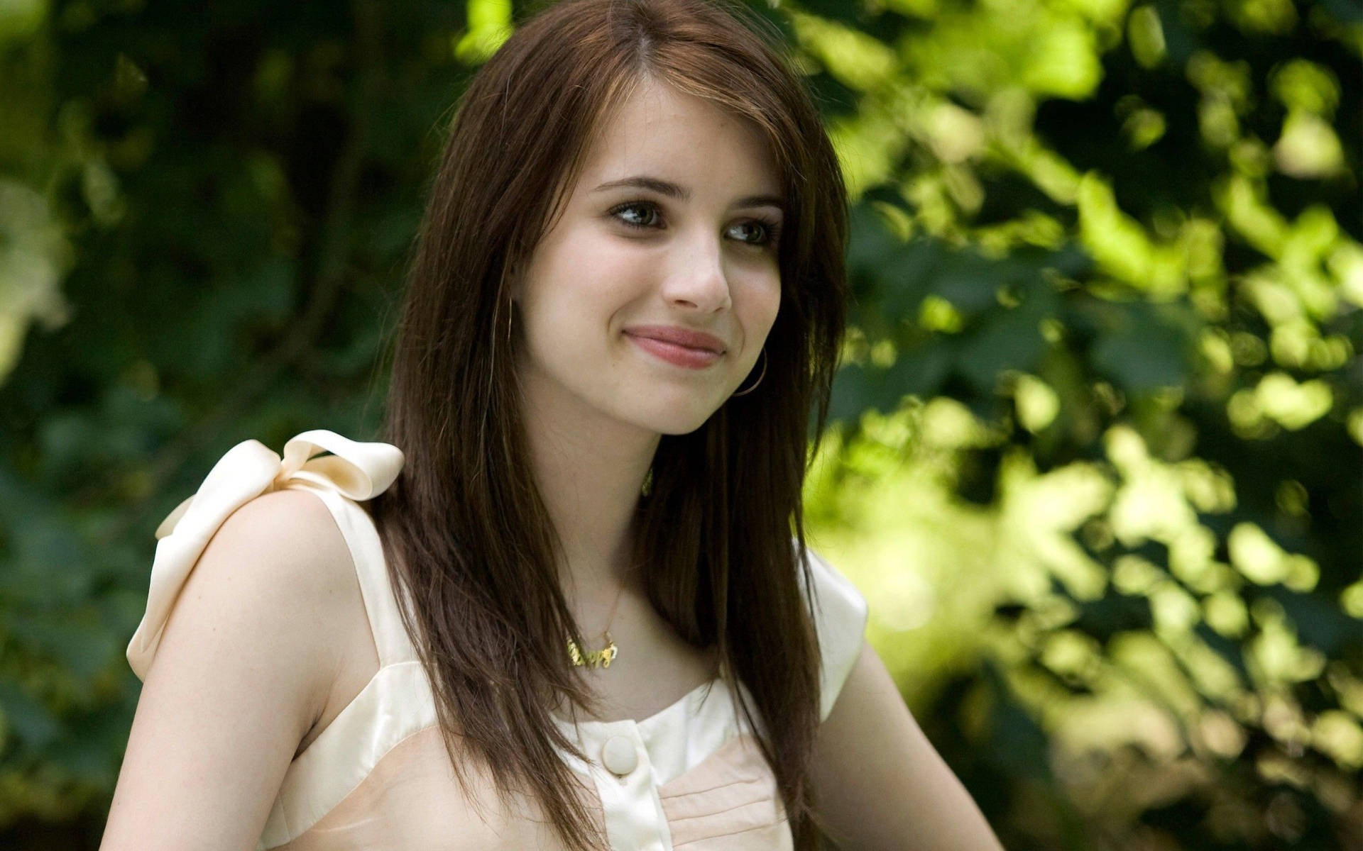 Pretty Woman Donning A Lovely Peach Top Background