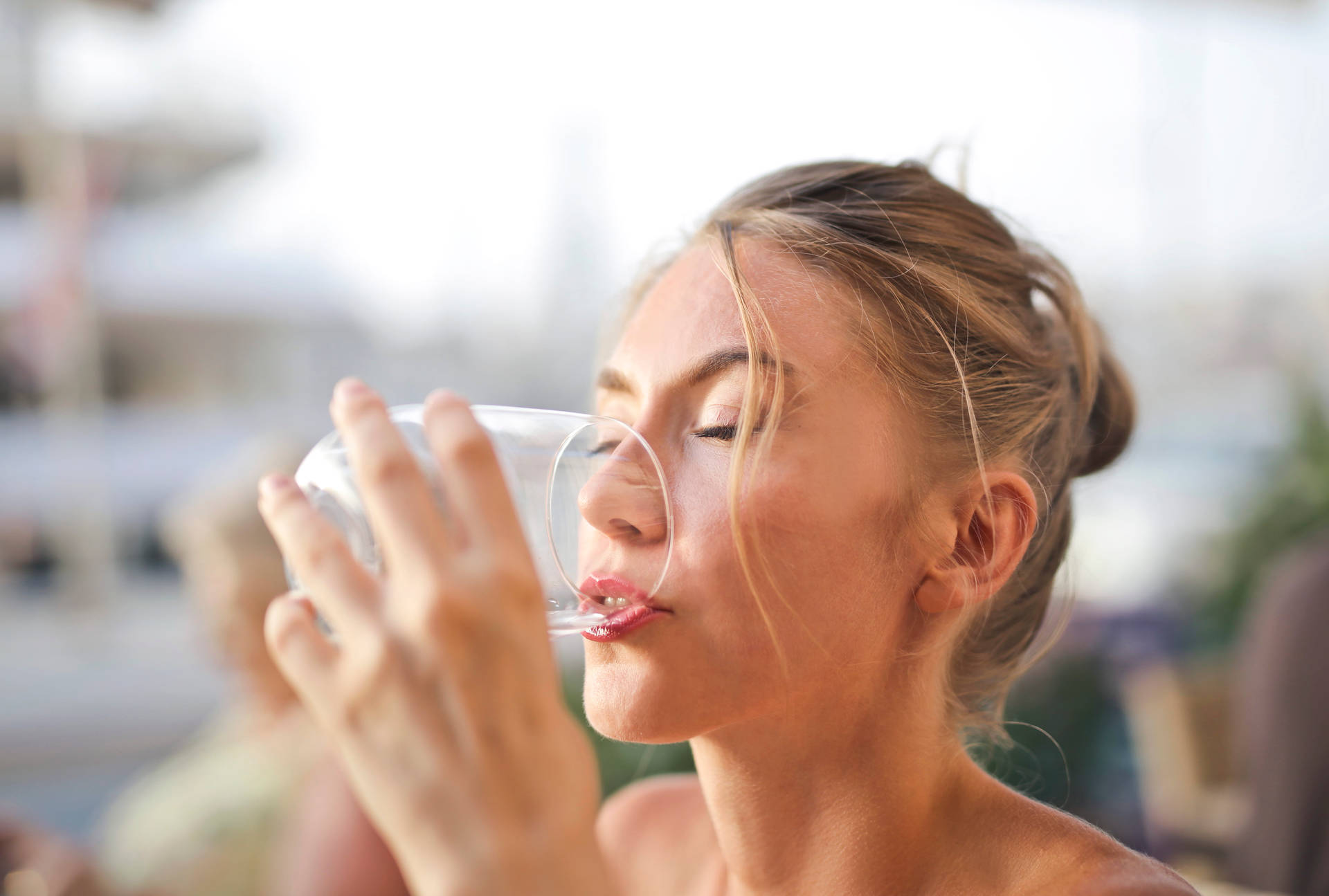 Pretty Woman Drinking Water From Glass Background