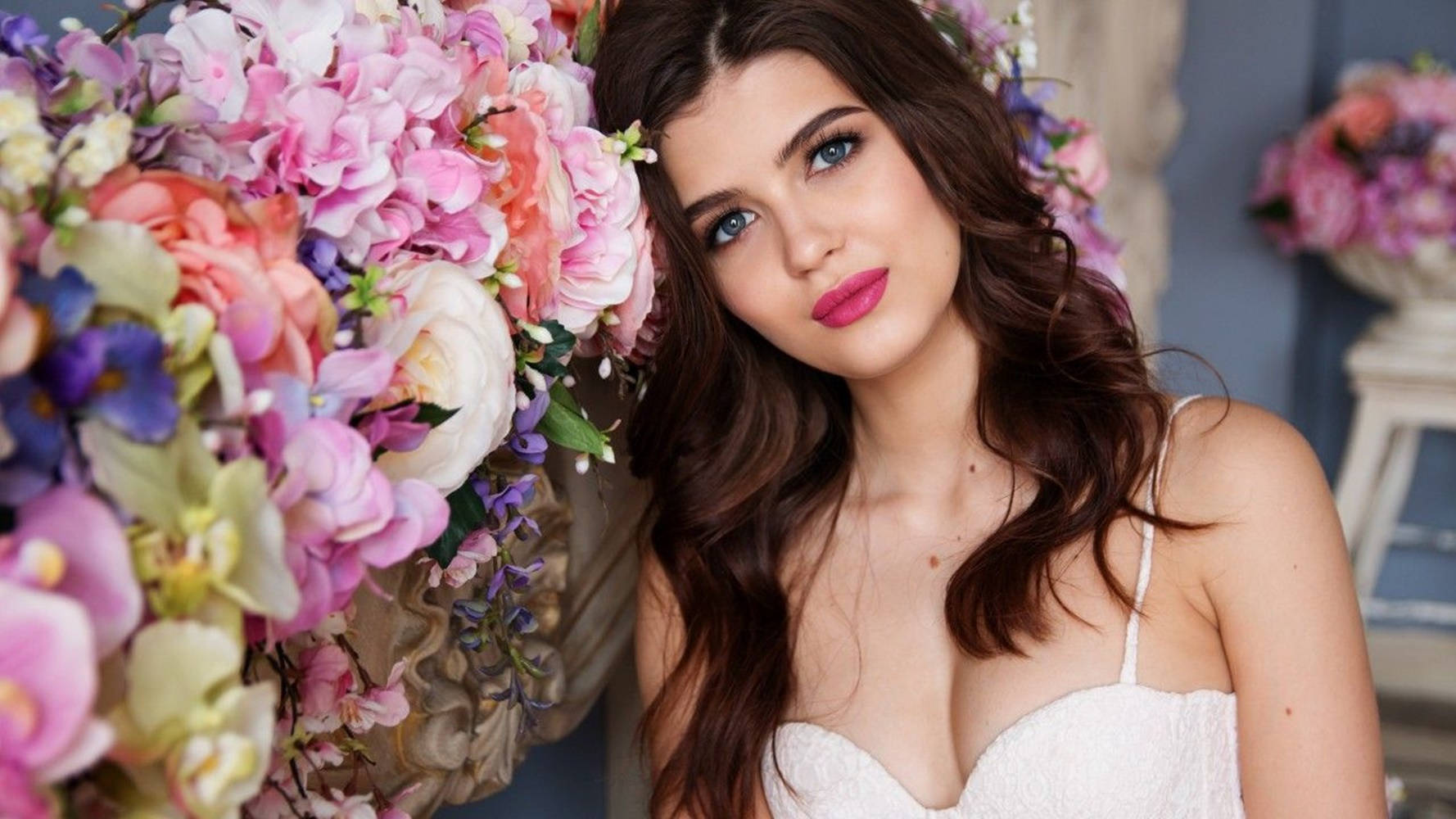 Pretty Woman Leaning On The Flowers Background