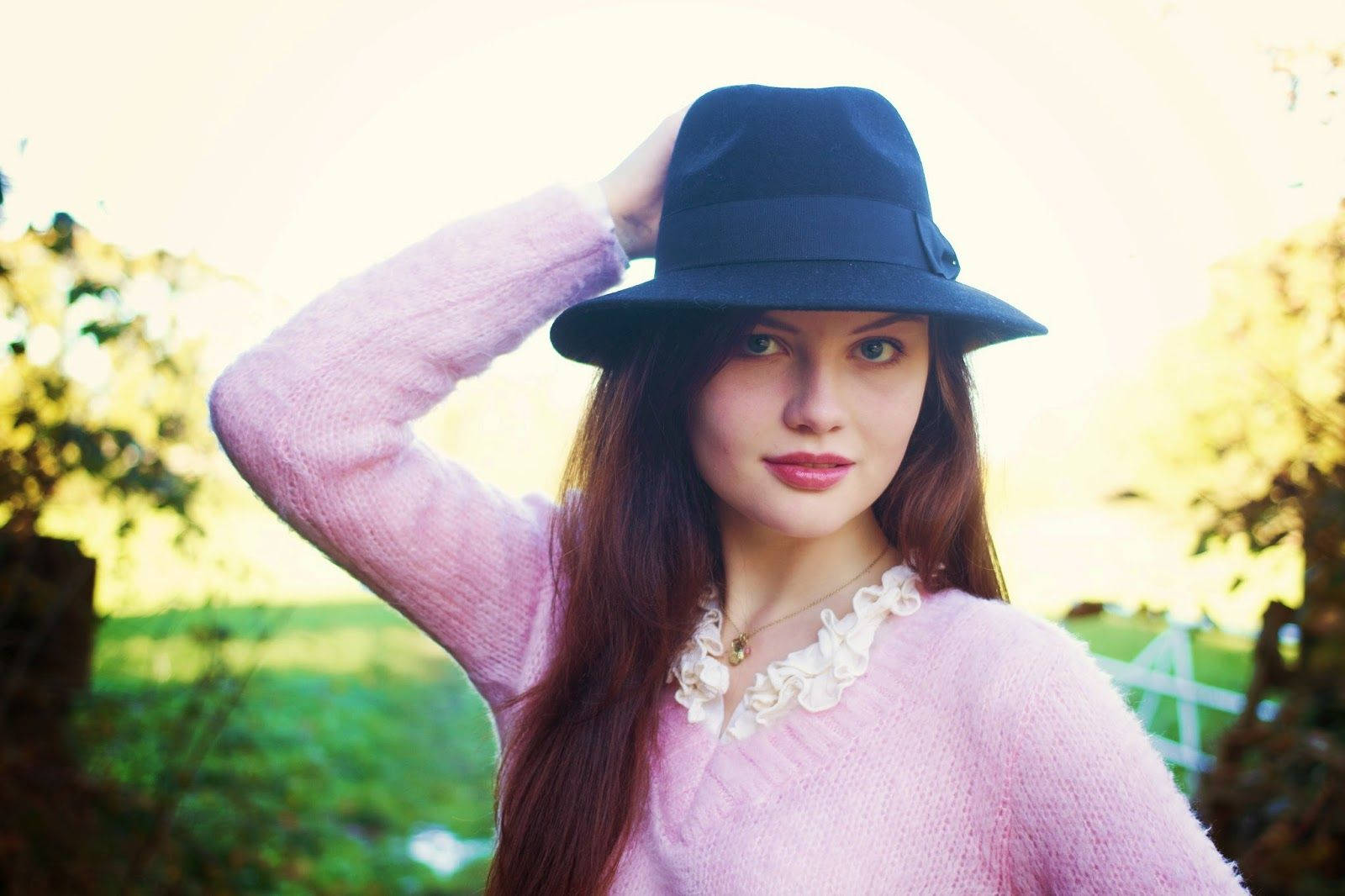 Pretty Woman Wearing A Black Bucket Background