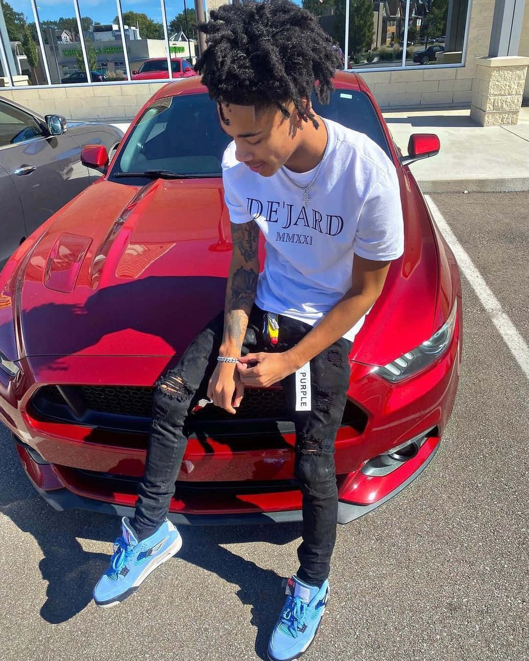 Prettyboyfredo Sitting On Red Car Background