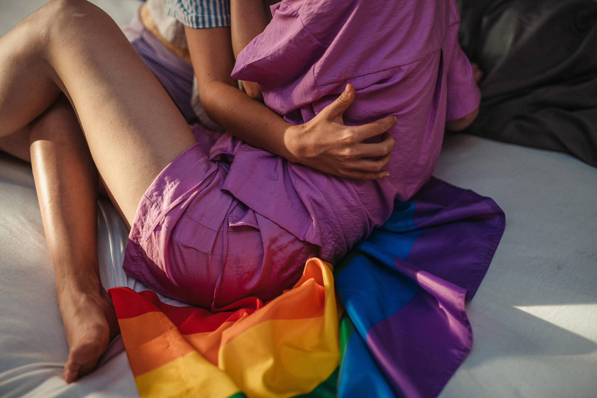 Pride Flag Couple Embracing Background
