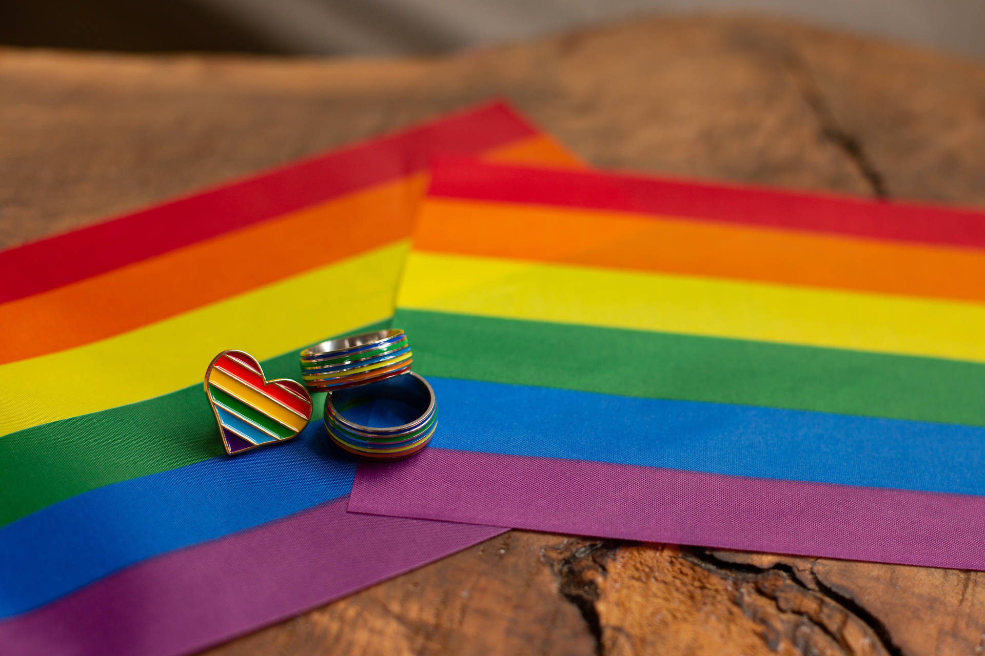 Pride Flags Rings And Pin Background