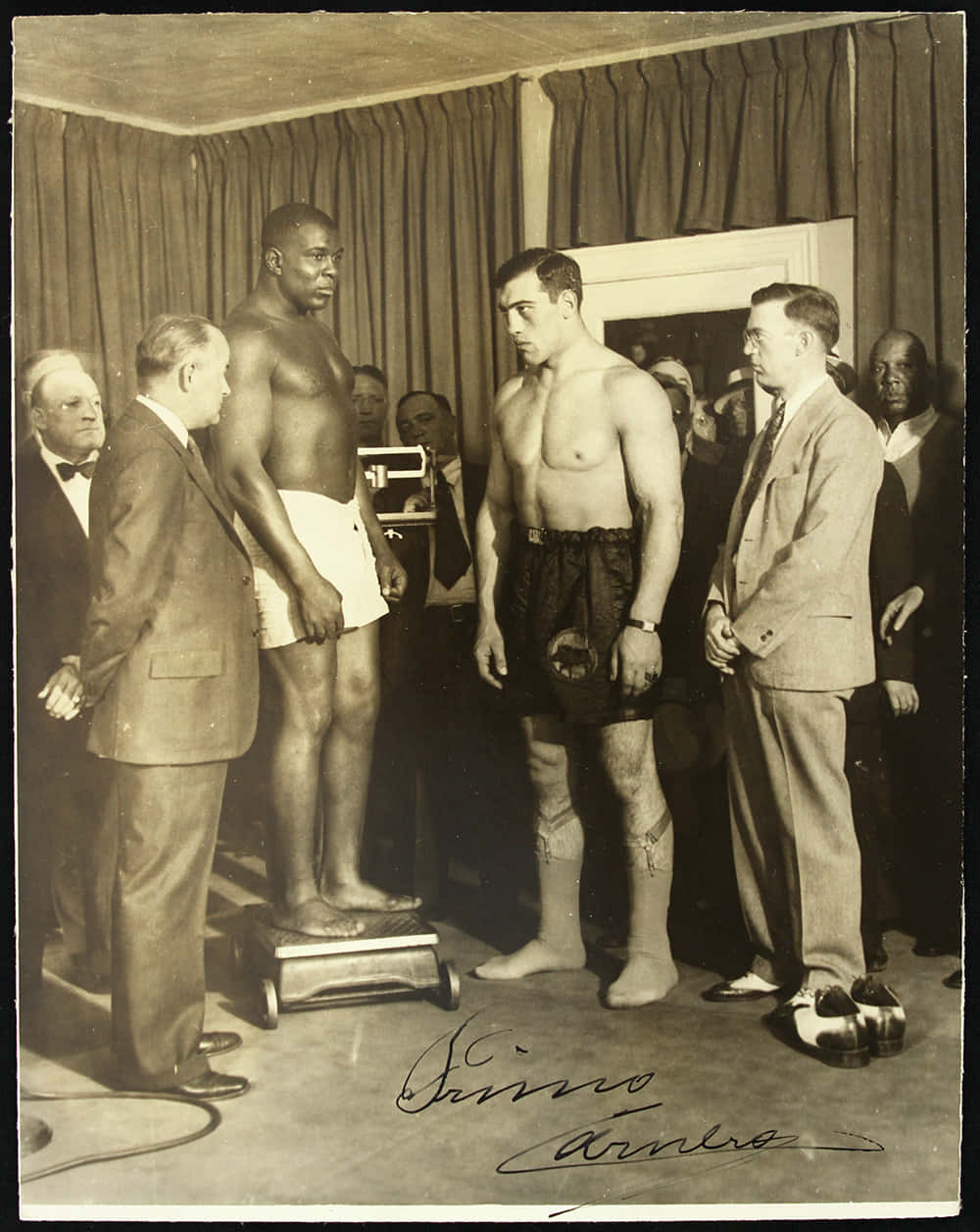 Primo Carnera During A Pre-fight Weigh-in