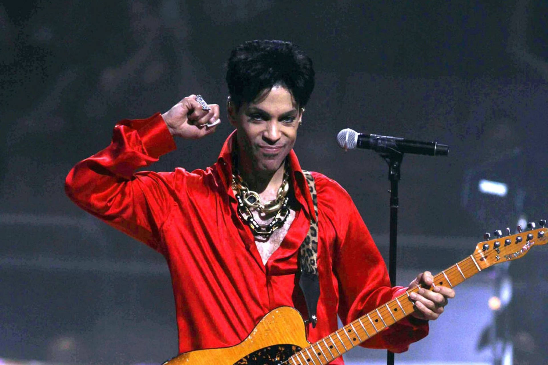 Prince In Red At Concert Background