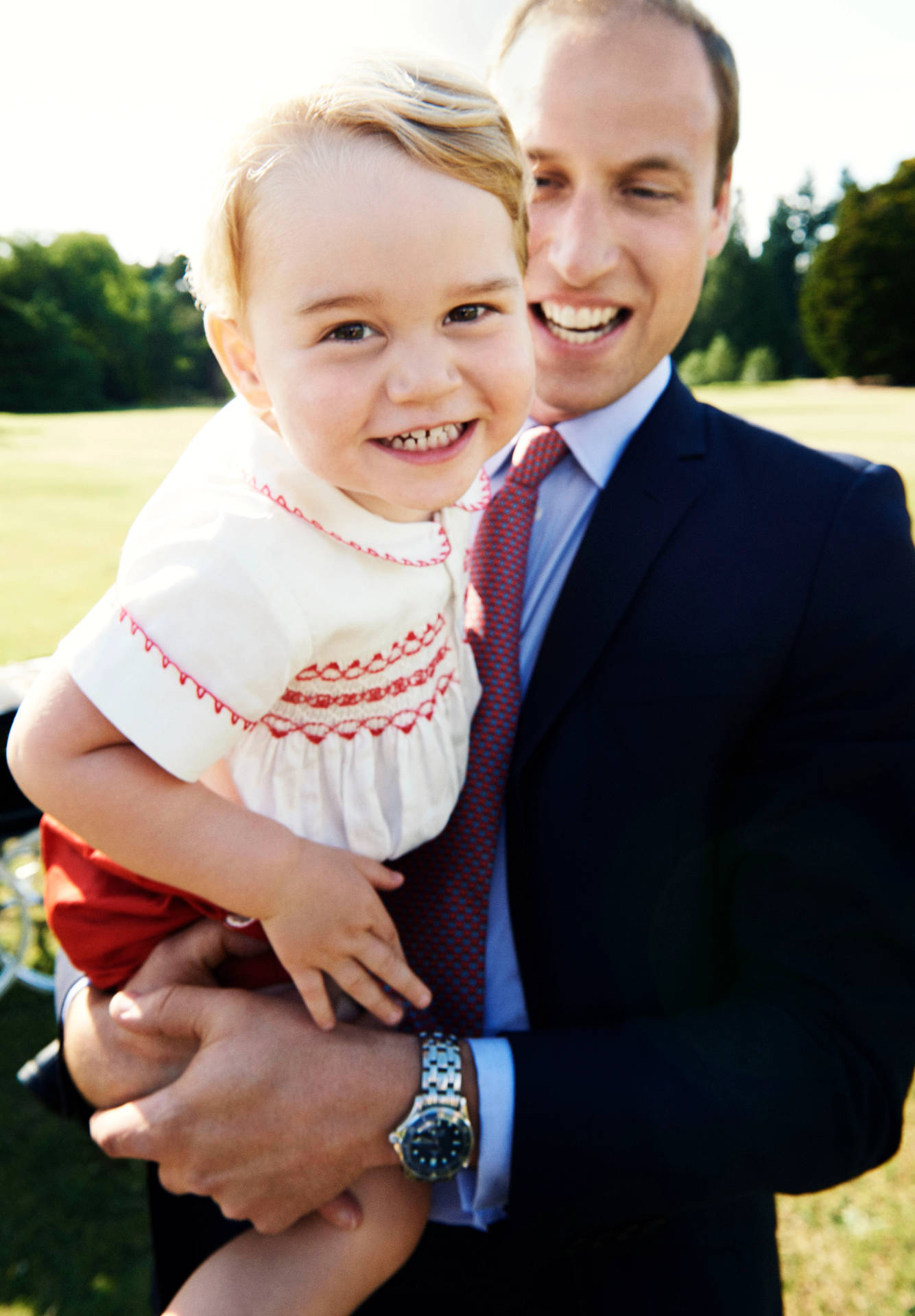 Prince William Carrying Prince George