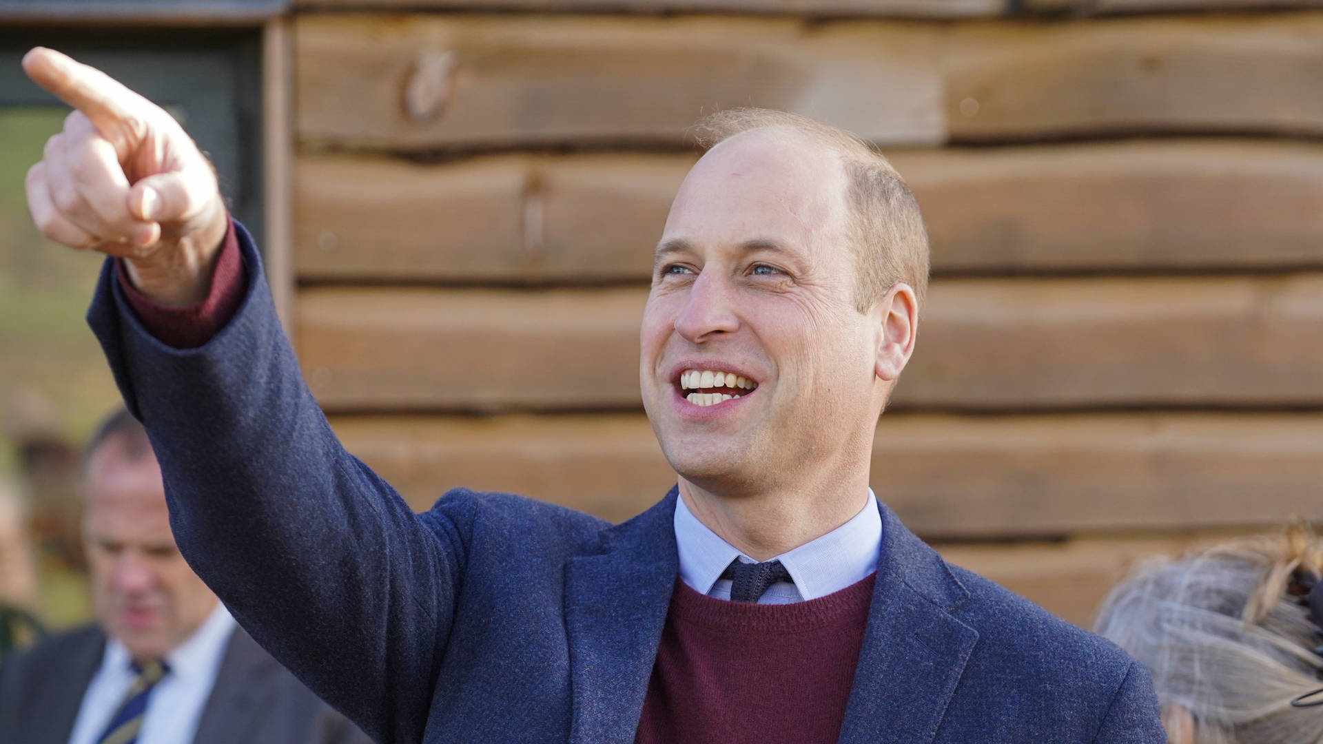 Prince William With A Cheerful Display Of Pointing And Smiling Background