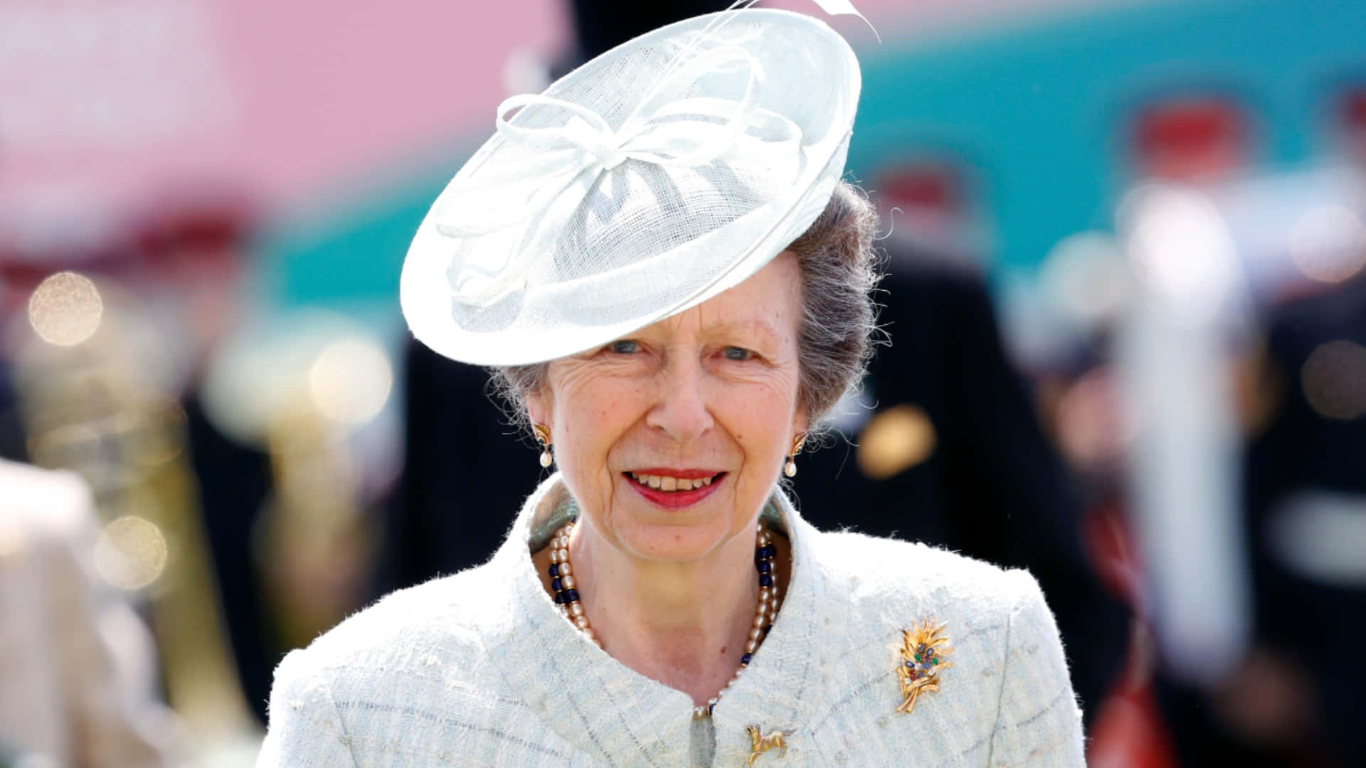 Princess Anne Adorned In Graceful All-white Outfit Background