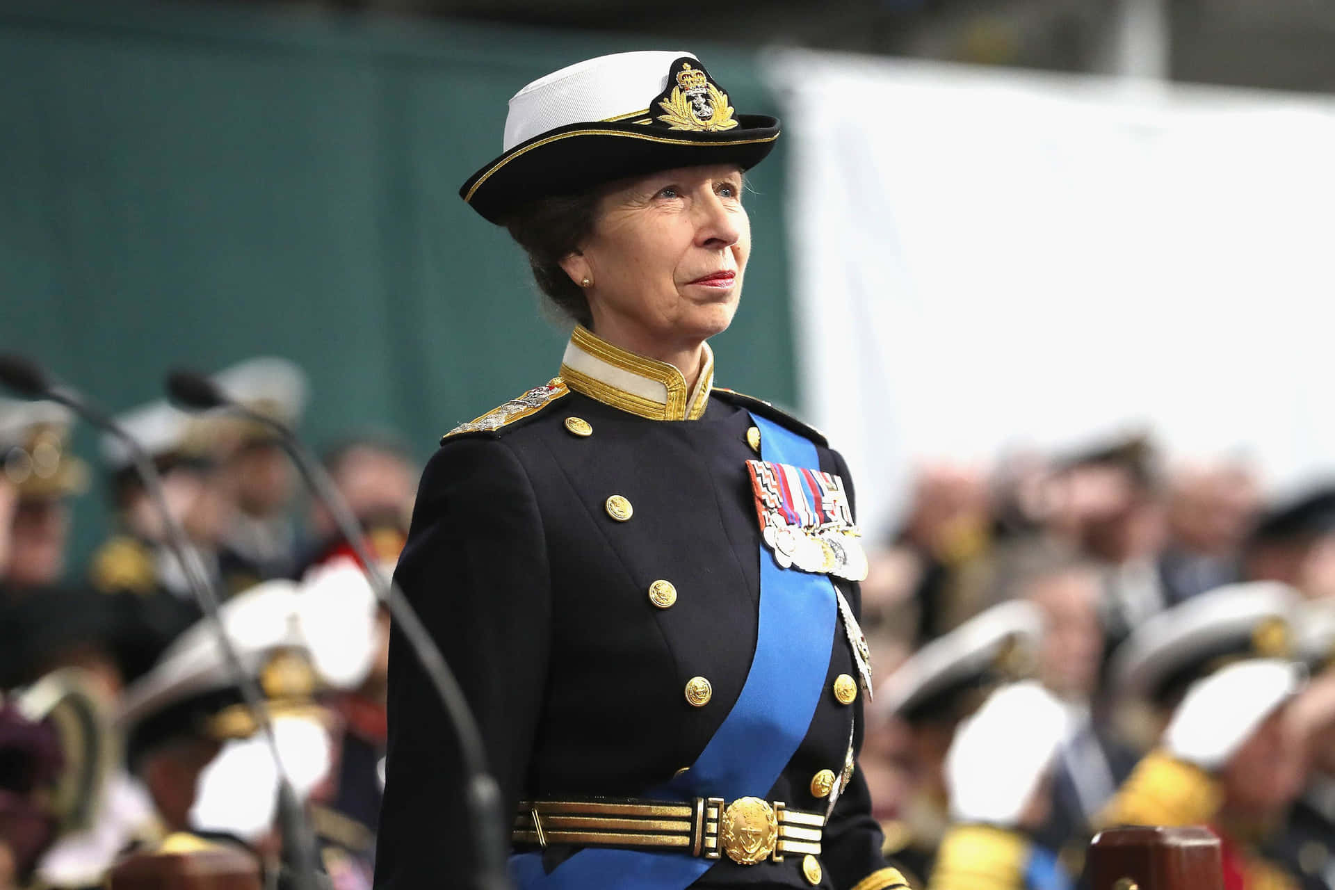 Princess Anne Adorned In Royal Military Suit Background