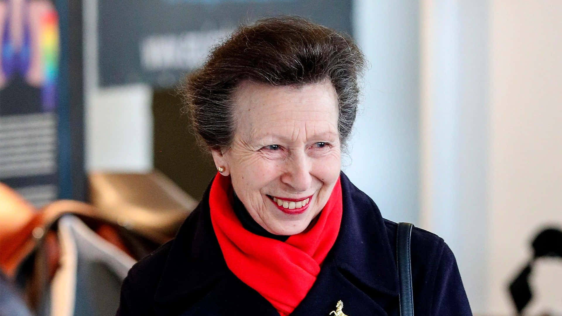 Princess Anne Wearing A Red Scarf Background