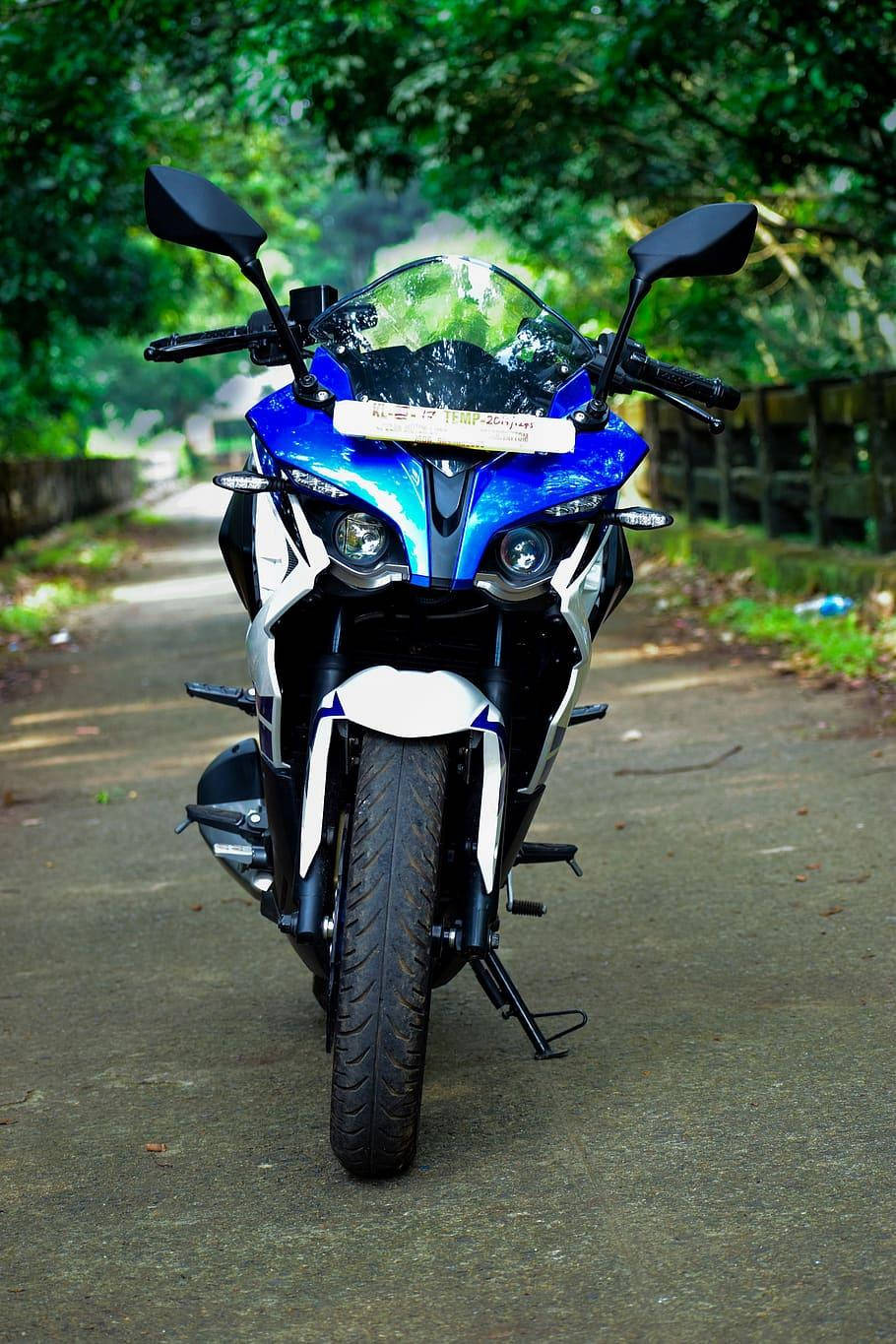 Pristine Blue Ns 200 Motorcycle Captured In High Definition Background