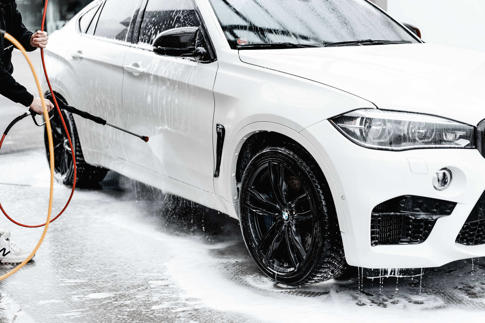 Pristine White Skyline Car In A Car Wash Background