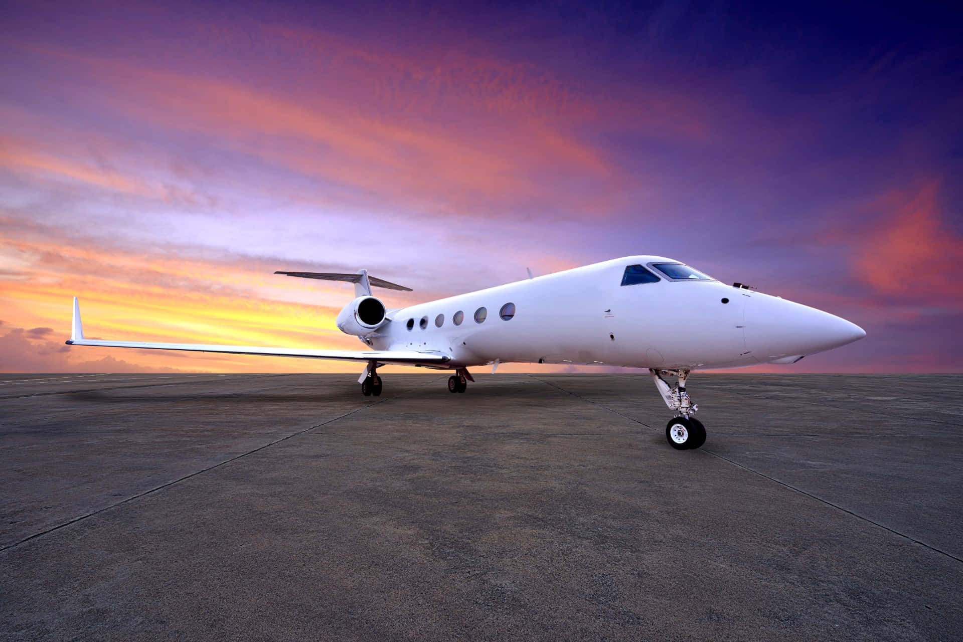 Private Jet Against Purple Sky Background