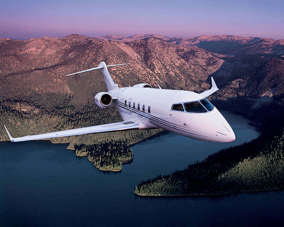 Private Jet Over Landscape Background