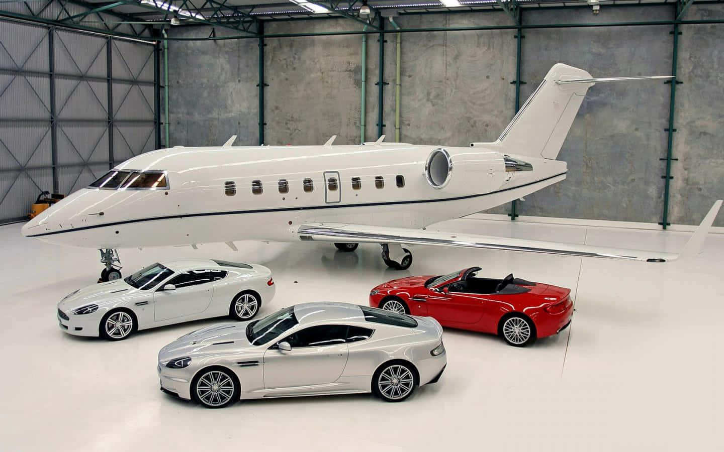 Private Jet With Luxury Cars Background