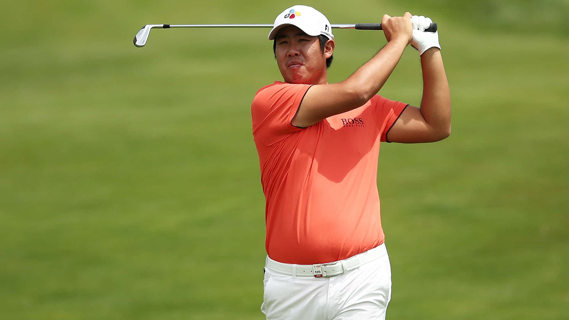 Pro Golfer Byeong Hun An Sporting An Orange T-shirt Background