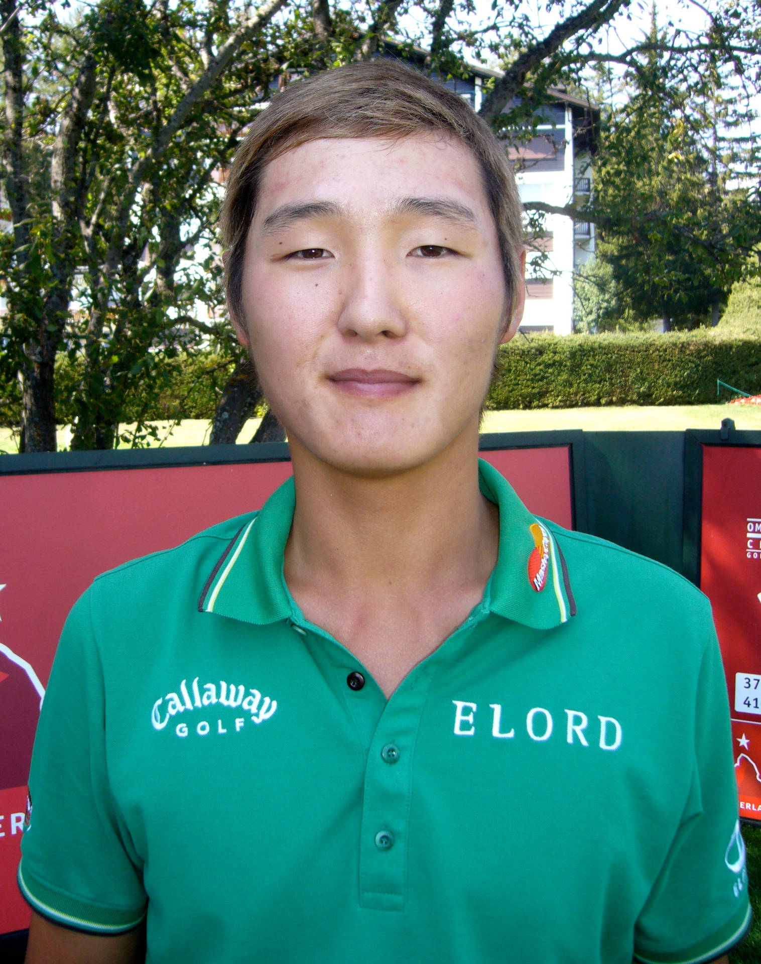 Pro Golfer Danny Lee Sporting A Green Top Background