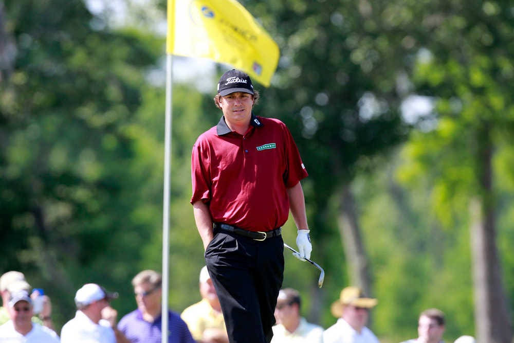 Pro Golfer Jason Dufner In A Bright Red Shirt Background