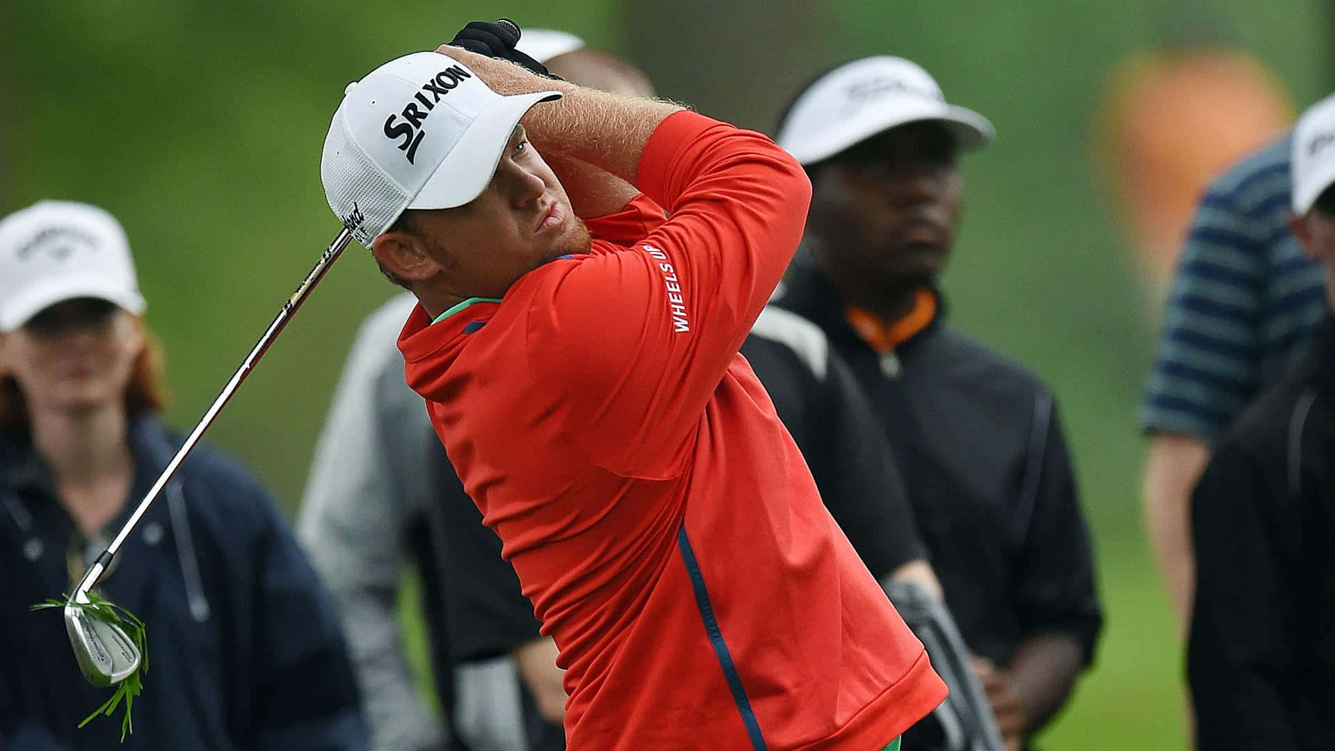 Pro Golfer Jb Holmes In Orange Background