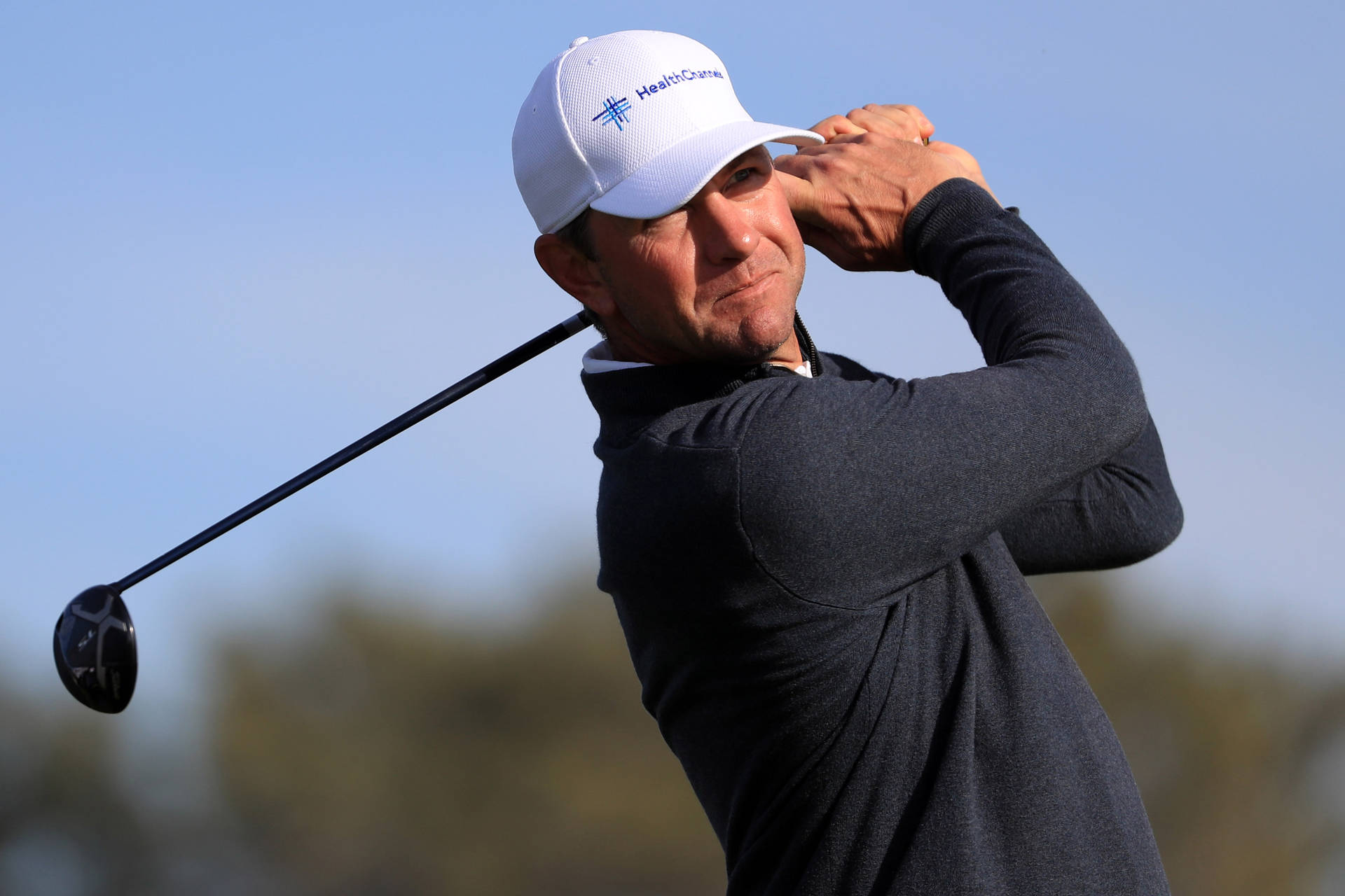 Pro Golfer Lucas Glover Deep In Concentration Background