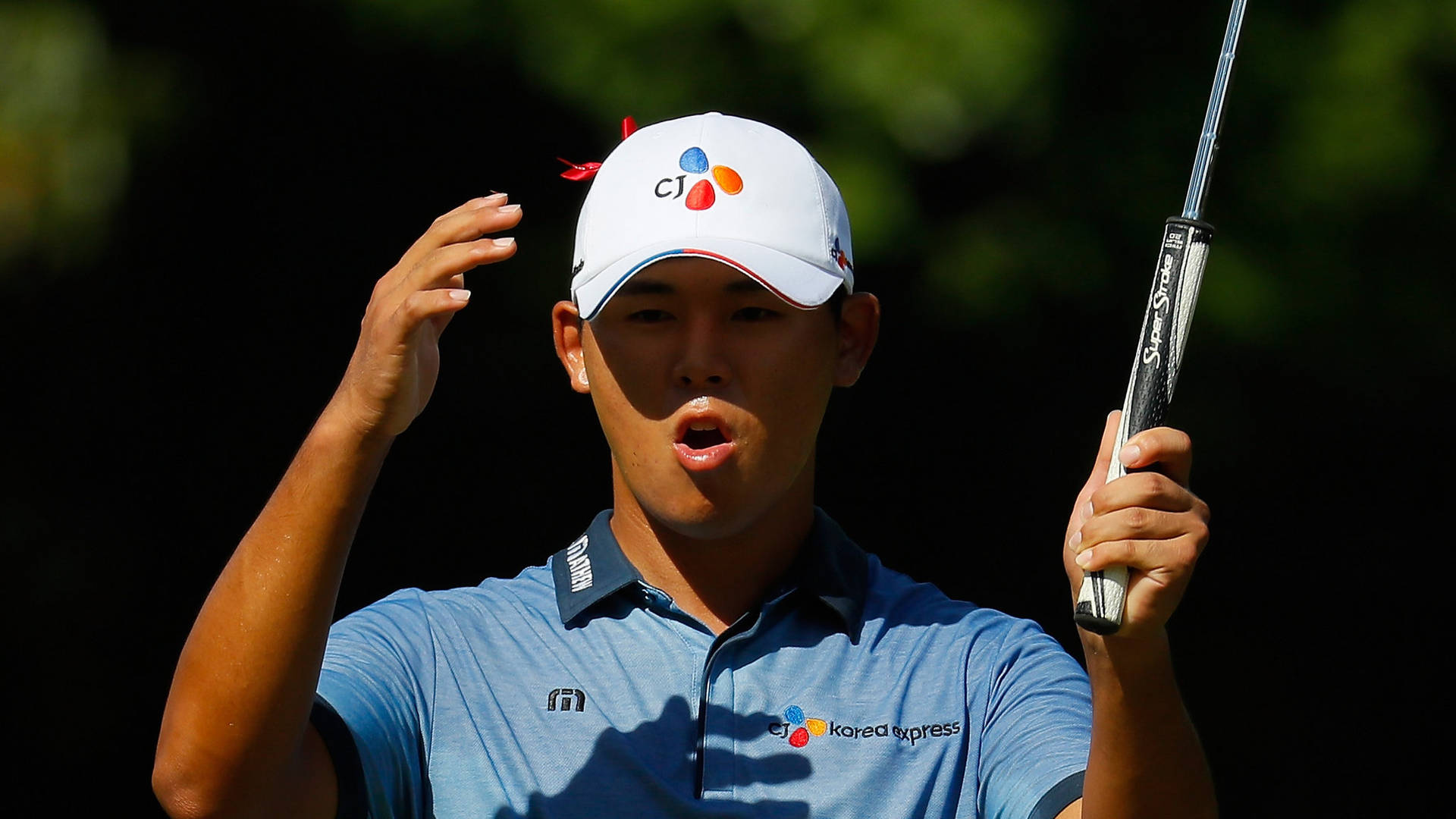 Pro Golfer Si Woo Kim Showing A Shocked Expression Background