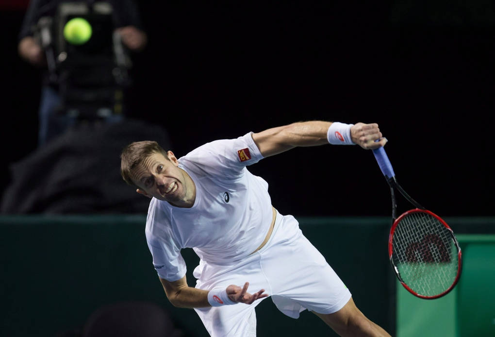 Pro Tennis Player Daniel Nestor In Rigorous Action Background