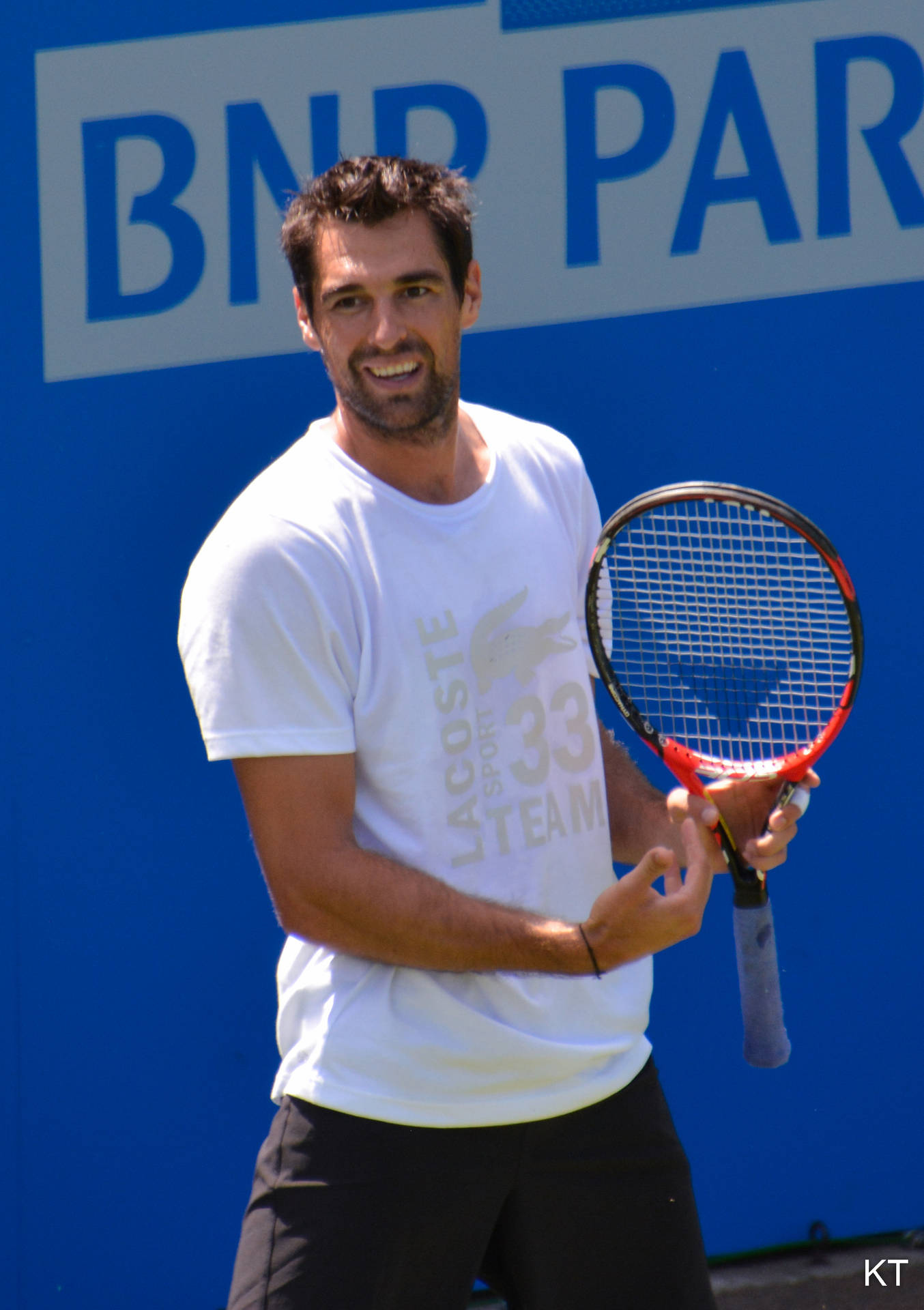 Pro Tennis Player Jeremy Chardy Acing A Match In A White Shirt Background