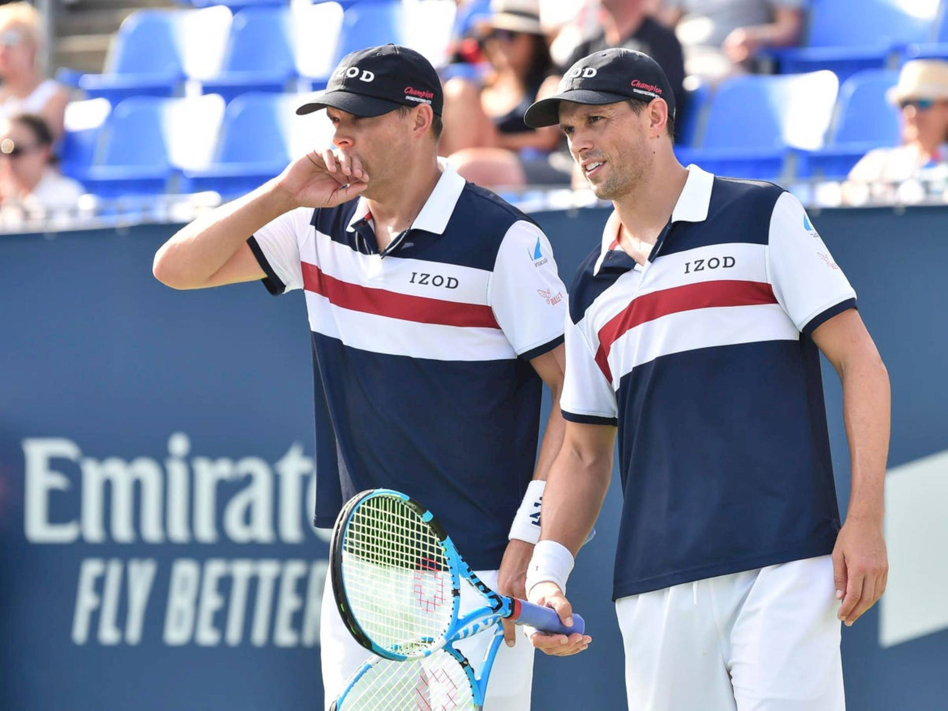 Pro Tennis Players Bob Bryan And Mike Bryan Gazing Afar Background