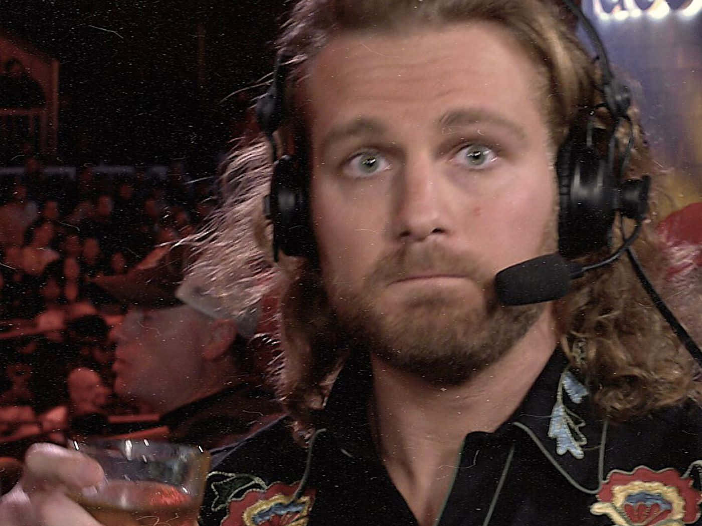 Pro Wrestler Adam Page Enjoying A Glass Of Whiskey Background