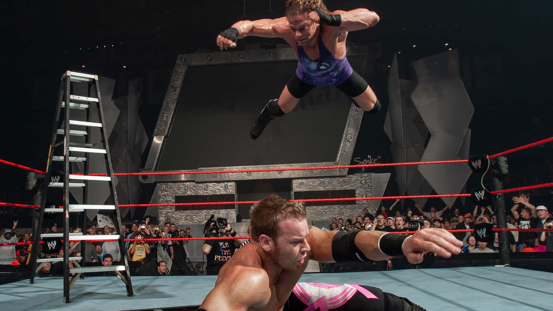 Pro Wrestlers Rob Van Dam And Christian Cage In Action Background