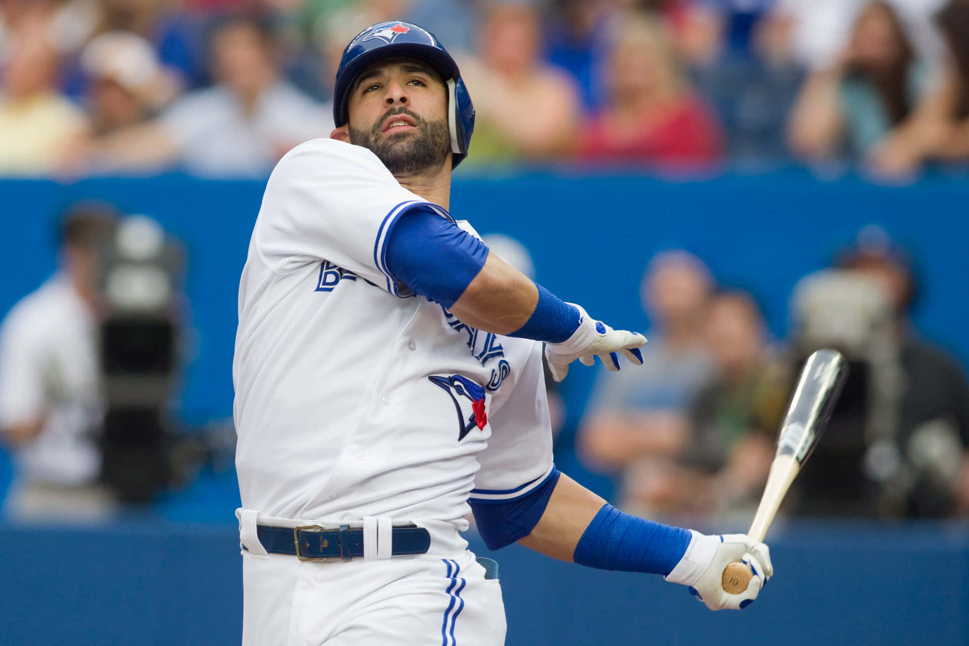 Professional Baseball Player Swings With Precision Background