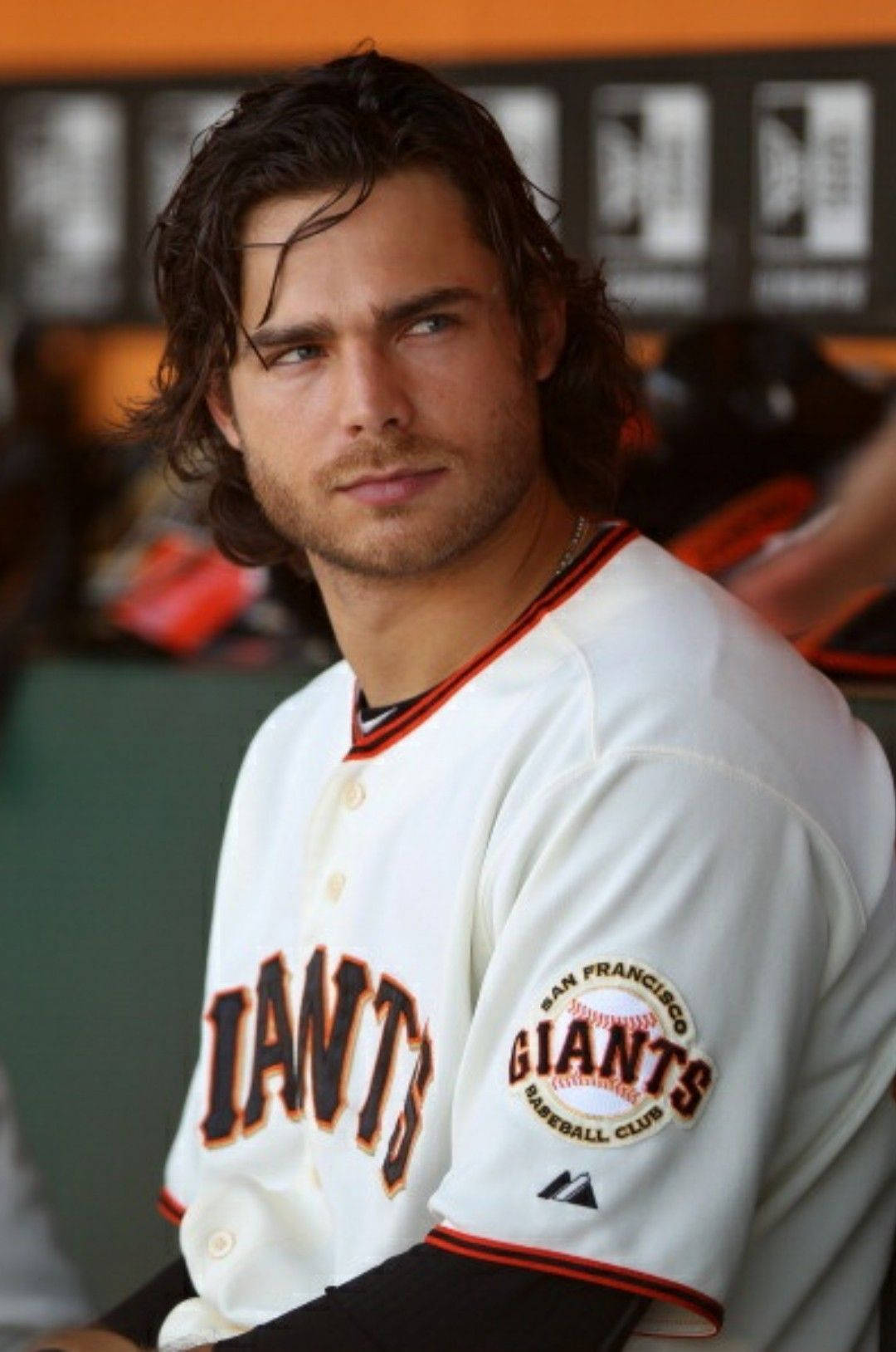 Professional Baseball Star Brandon Crawford With His Iconic Long Hair Background