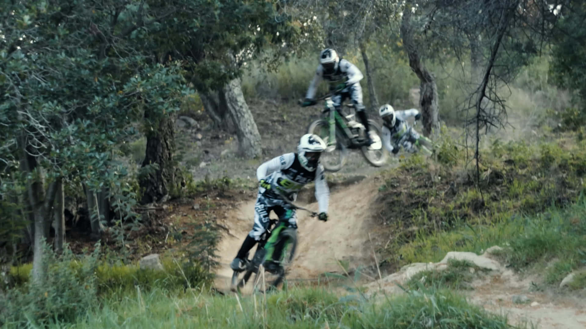 Professional Bmx Rider Competing In A Race Background