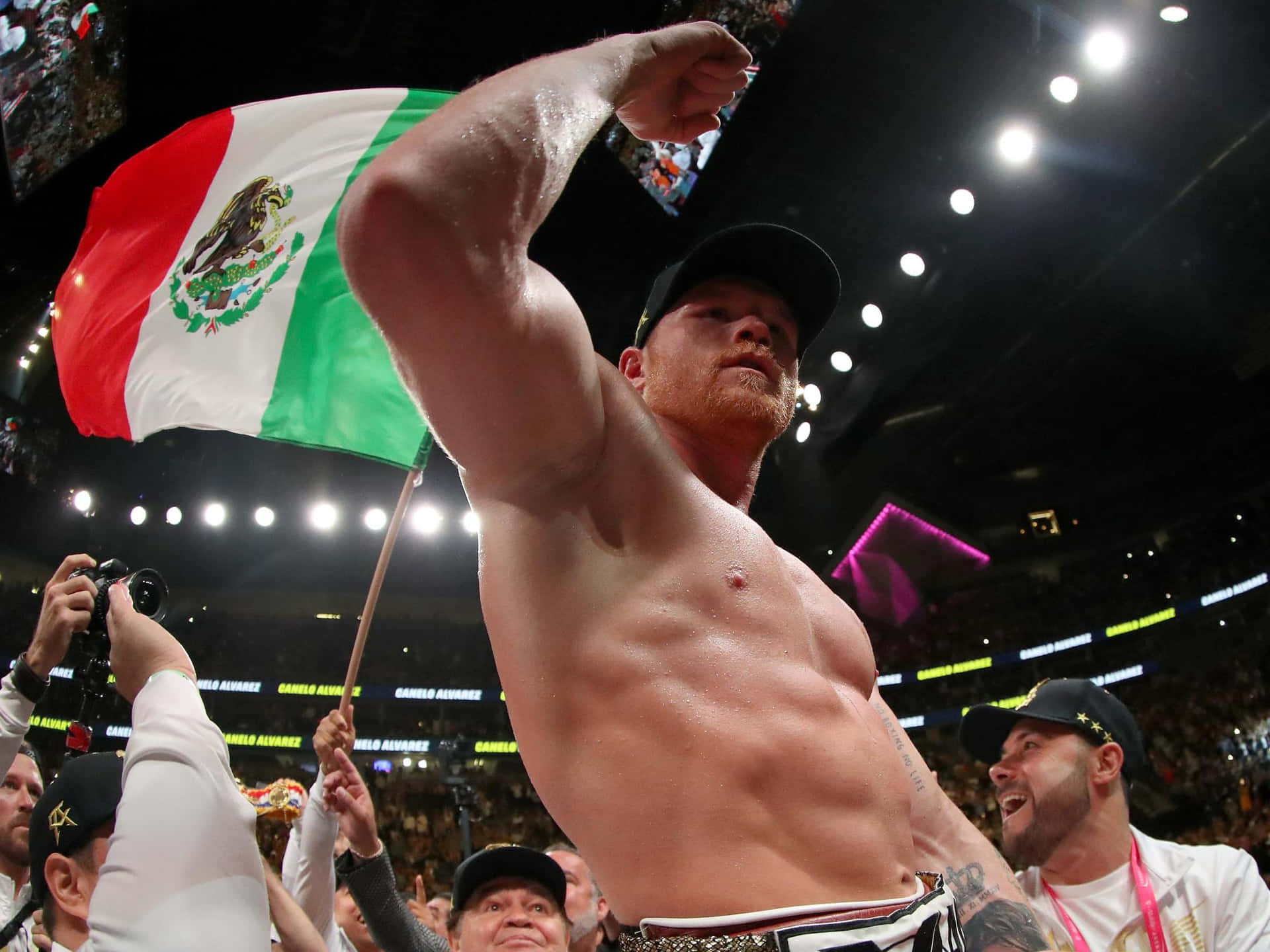Professional Boxer Saul 'canelo' Alvarez Showcasing His Impressive Muscular Biceps Background