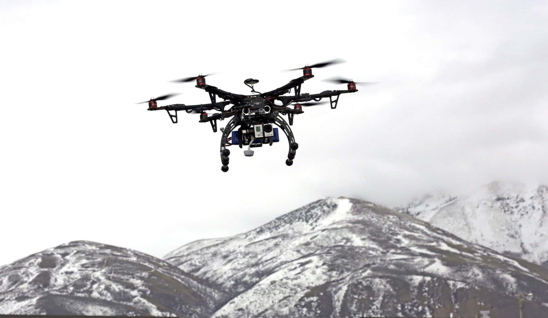 Professional Dronein Mountainous Terrain.jpg Background