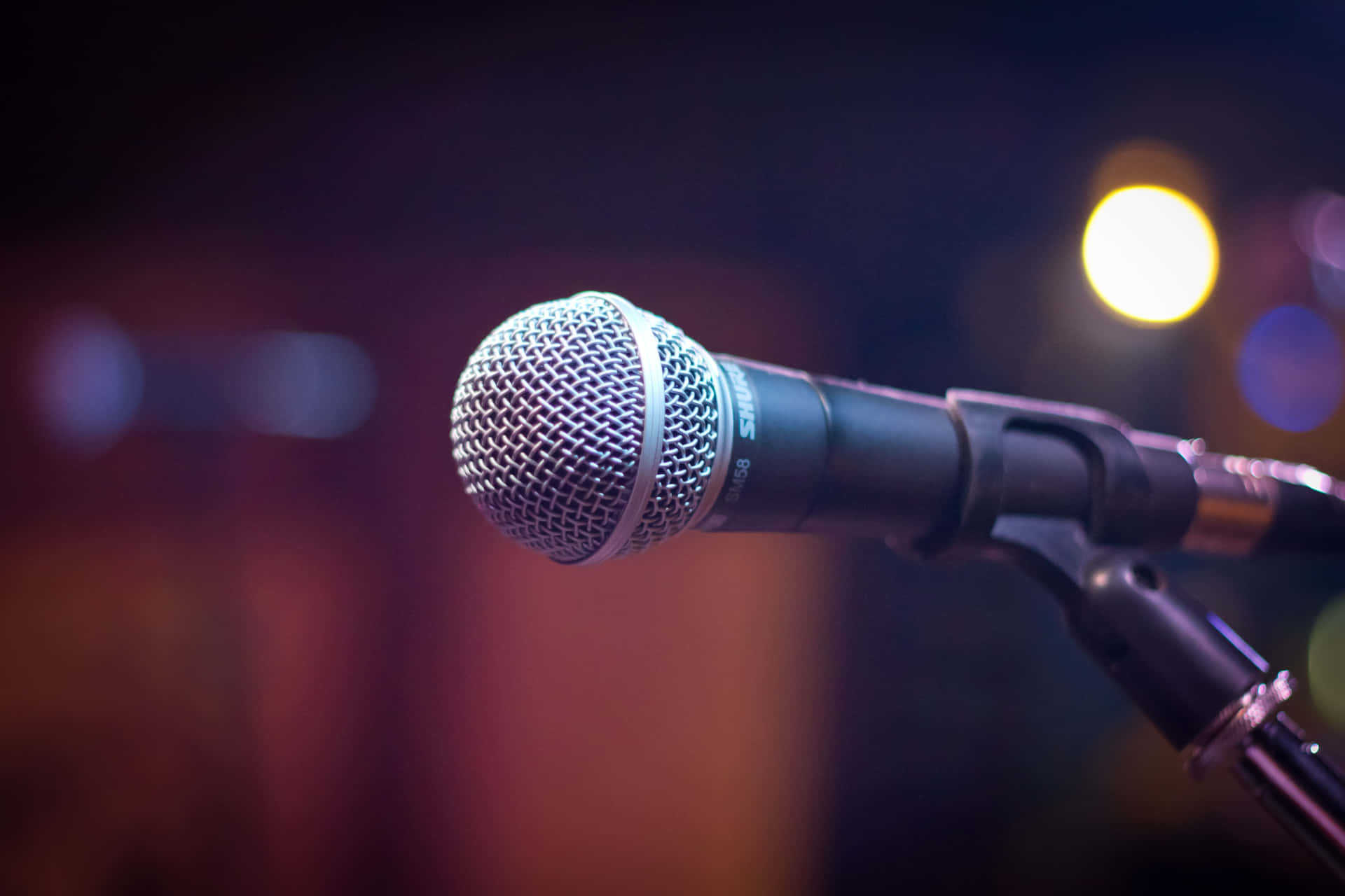 Professional Dynamic Microphone Under The Spotlight Background