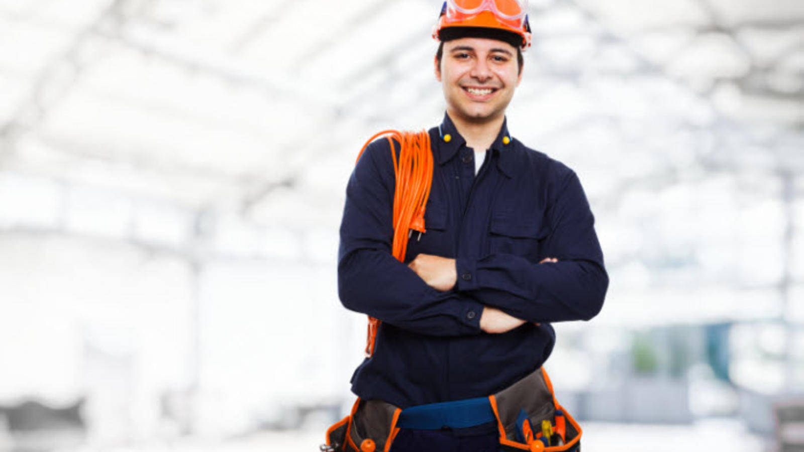 Professional Electrician Smiling At Work Background