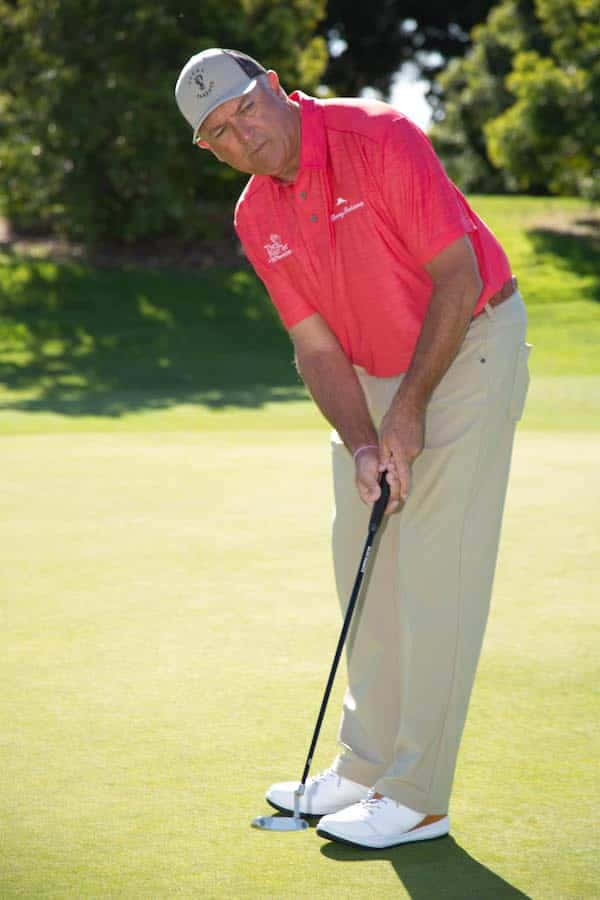 Professional Golf Player Ken Duke Getting Ready To Hit Background