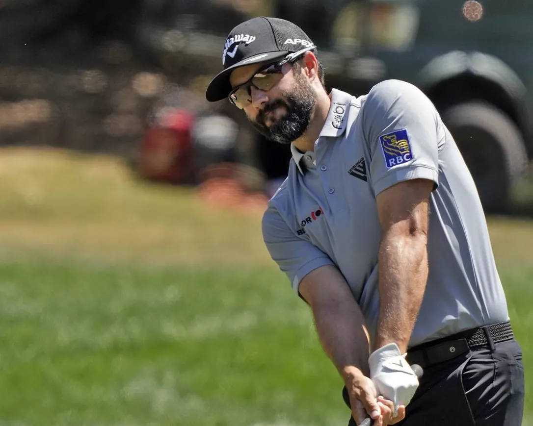 Professional Golfer Adam Hadwin In Action Background