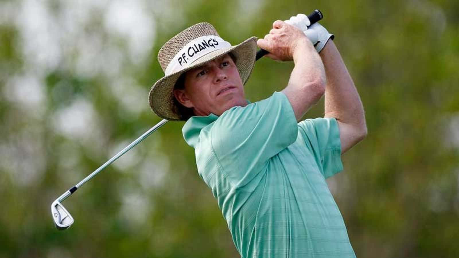 Professional Golfer Briny Baird In Action Background