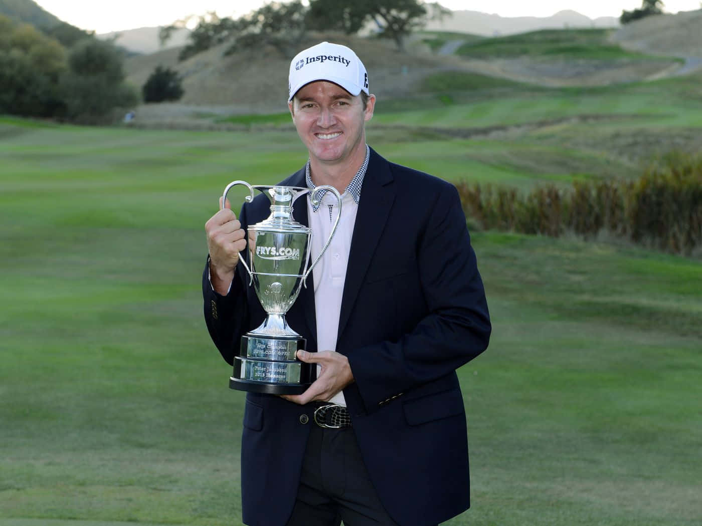 Professional Golfer Briny Baird In Action Background