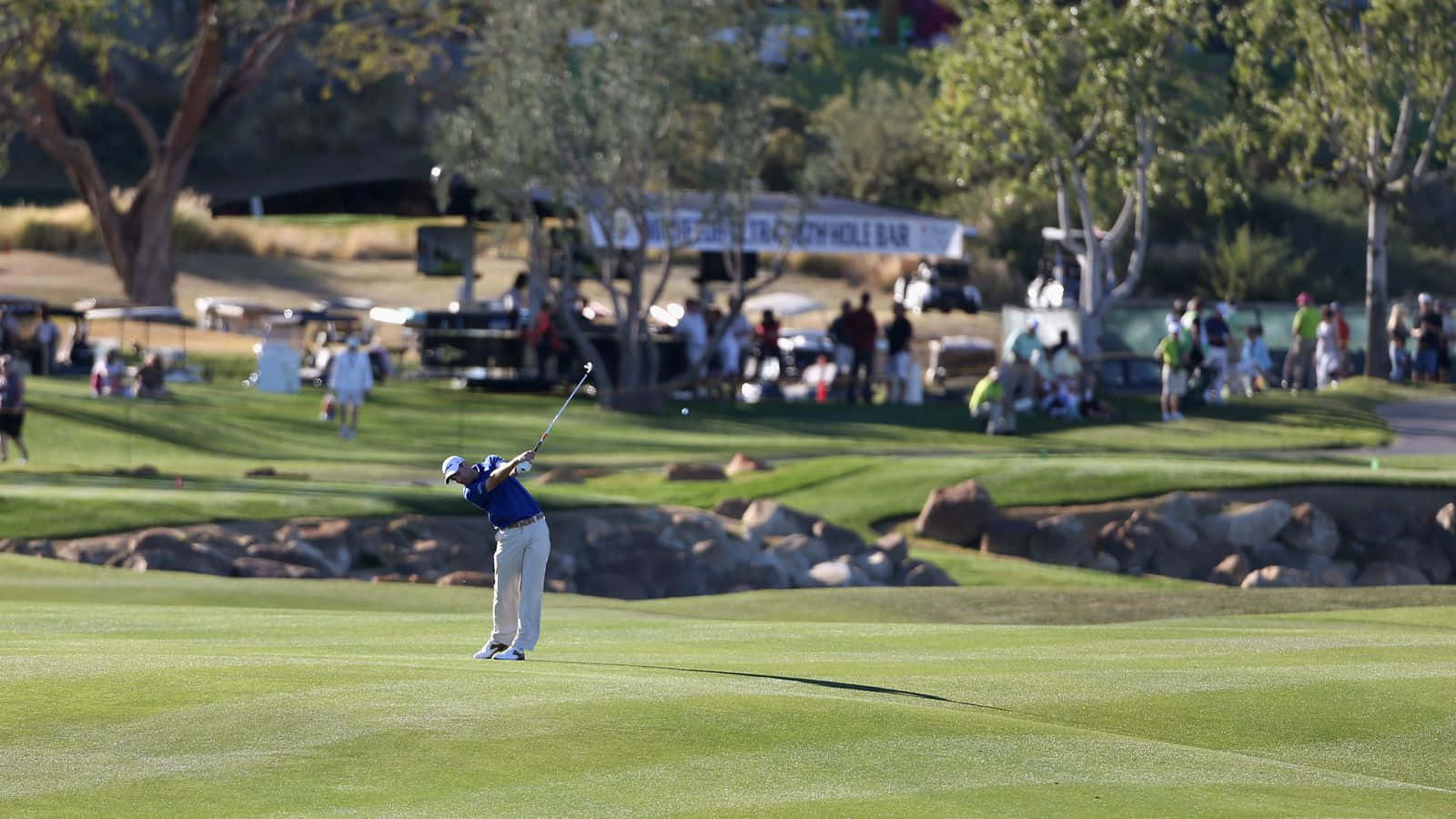 Professional Golfer Briny Baird In Action Background